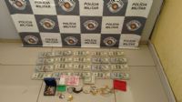 Dupla � presa com mais de 200 mil d�lares em �nibus e tenta subornar policiais
